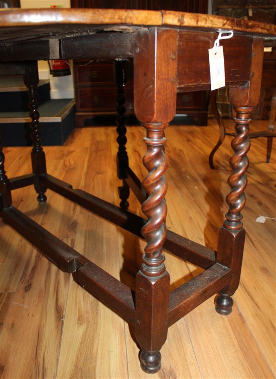 An 18th century walnut oval gateleg dining table, extended 4ft 9in.